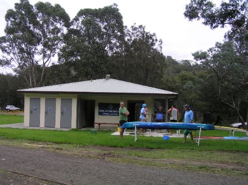 Sutherland Shire Canoe Club members cleaning their kayaks at the club house after a paddle on the Woronora River